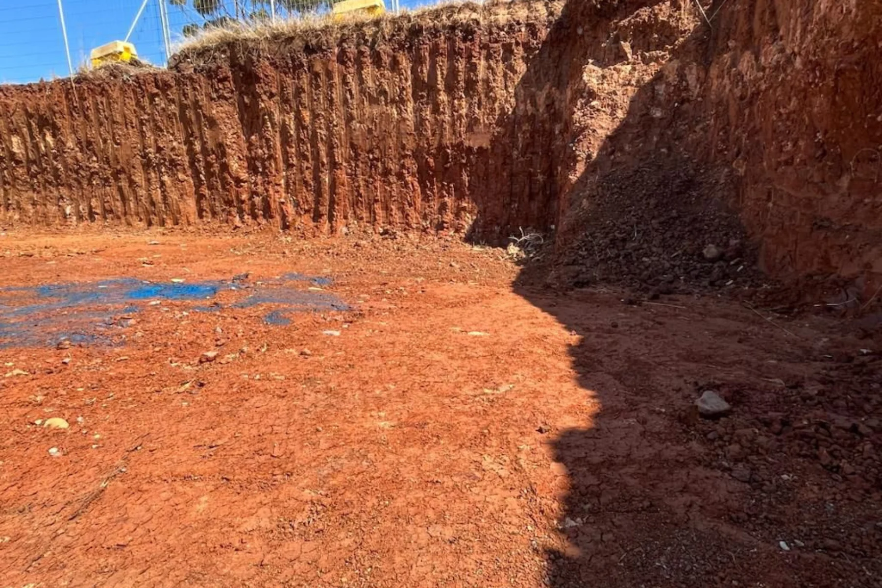 Excavator digging in rocky soil